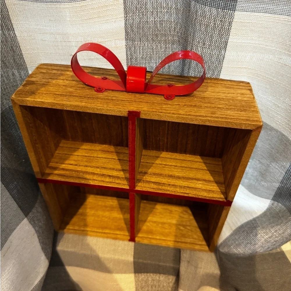 Elegant Brown Wooden Wall Shelf with Red Accents
